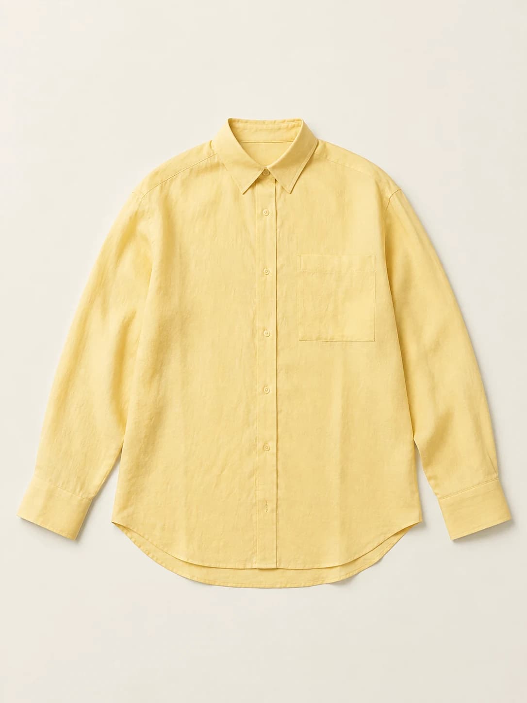 Butter-yellow linen shirt shown as a flat-lay product reference